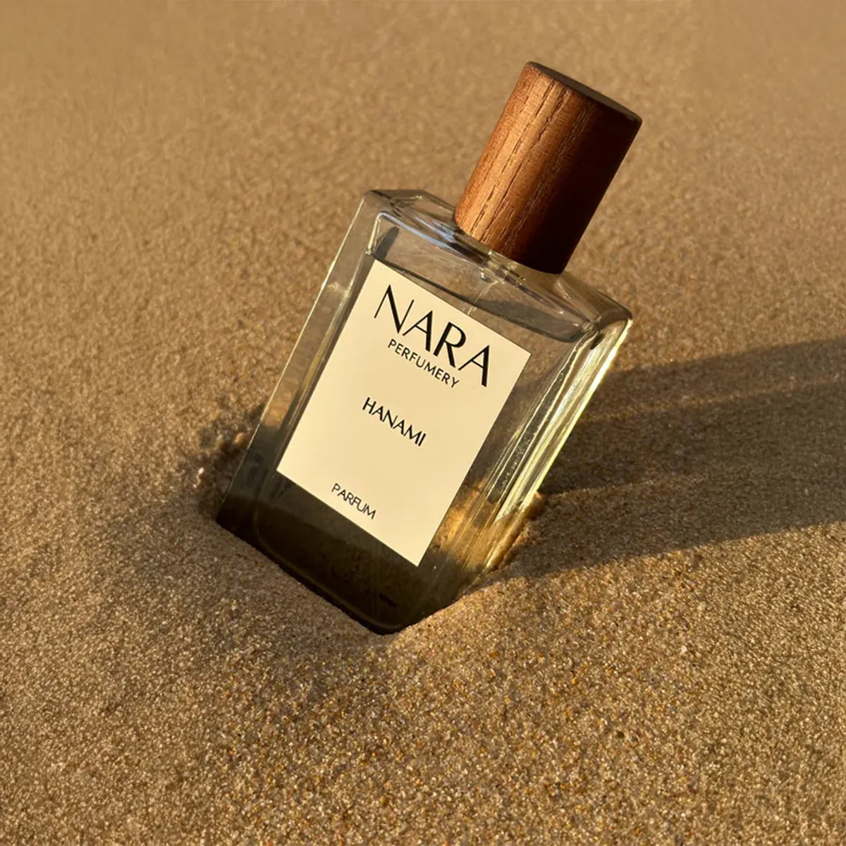 Nara Perfume bottle on sand