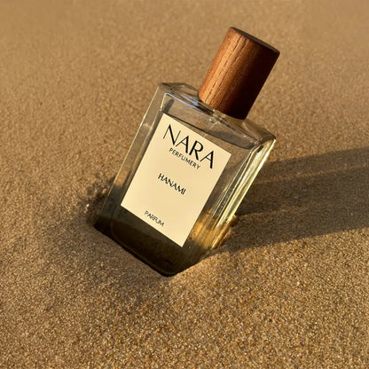 Nara Perfume bottle on sand
