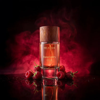 Perfume bottle labeled 'Raspberry Oud' with raspberries on a dark background