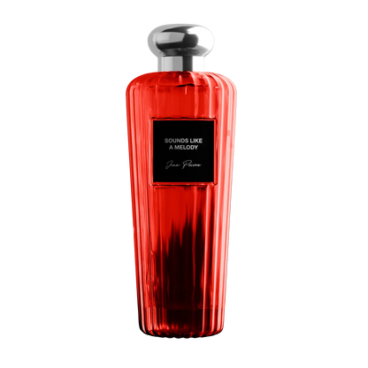 Red perfume bottle with silver cap on a white background