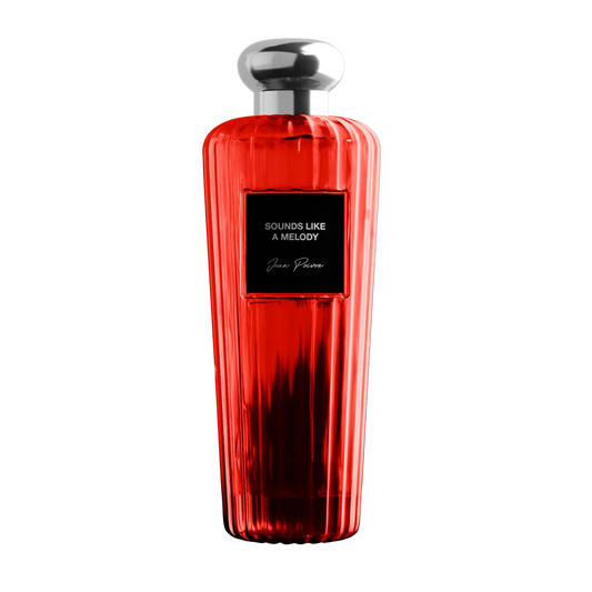 Red perfume bottle with silver cap on a white background