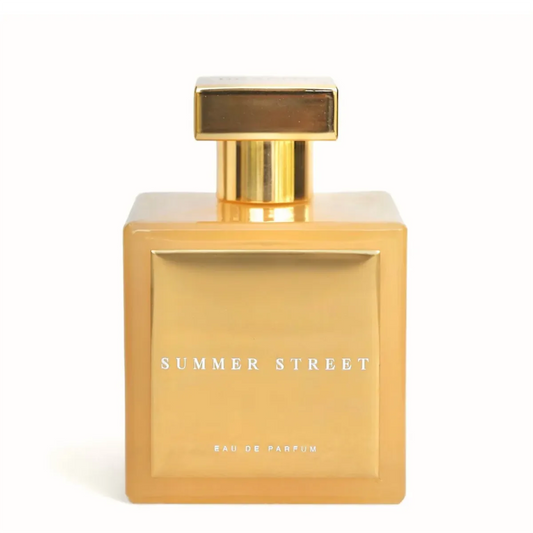 Gold perfume bottle labeled 'Summer Street' on a white background